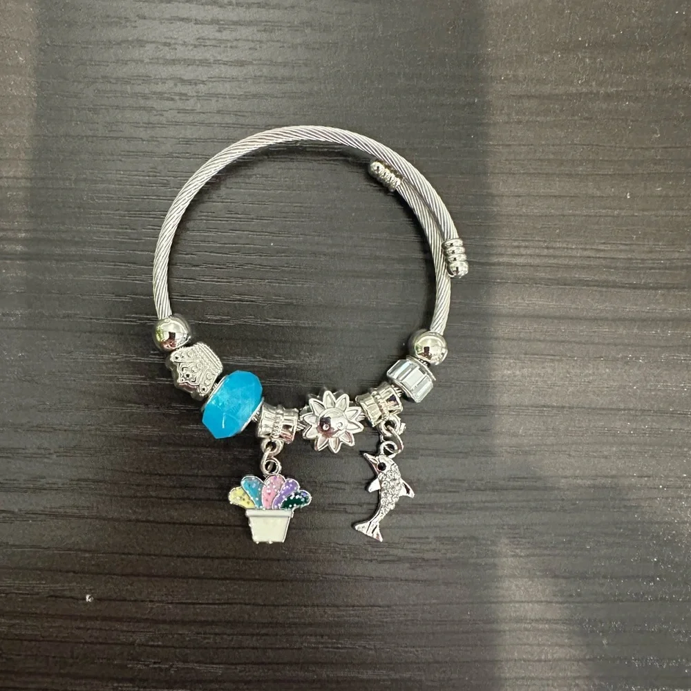 Stainless Steel Cable Charm Bracelet – Blue Bead Dolphin & Celestial Charms